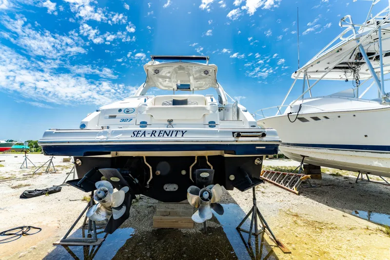Slide: The Image of 2013 Chaparral 327 SSX boat on stands, clear sky background. - 85