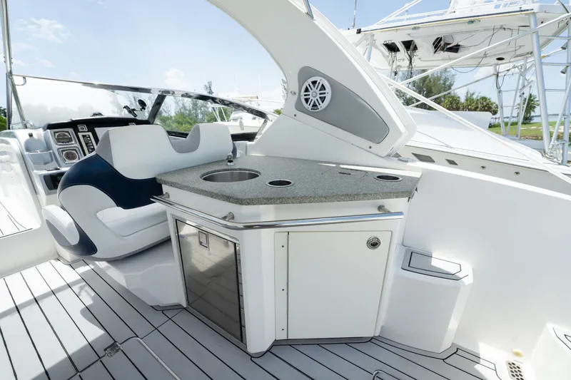Slide: The Image of 2013 Chaparral 327 SSX boat interior with sleek seating and modern amenities. - 68
