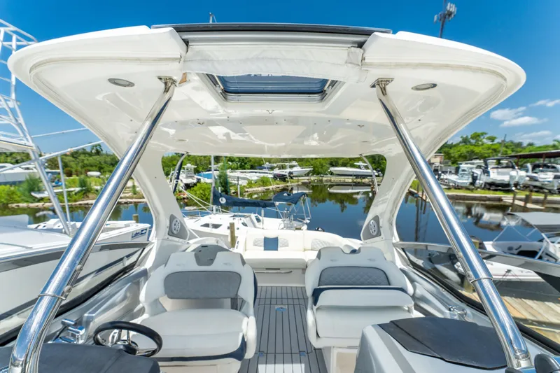 Slide: The Image of 2013 Chaparral 327 SSX boat interior with sleek seating and modern design. - 64