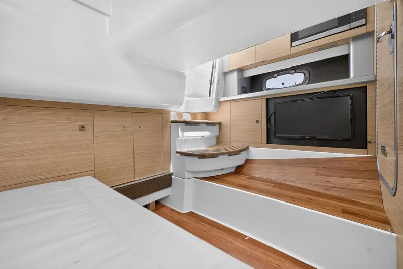 Slide: The Image of Interior of 2013 Chaparral 327 SSX boat with wood flooring and modern cabinetry. - 41