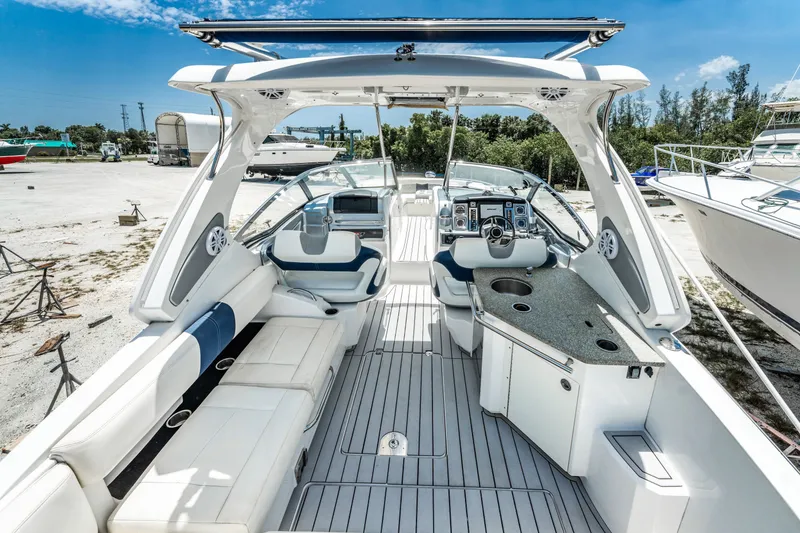 Slide: The Image of 2013 Chaparral 327 SSX boat interior with luxurious seating and modern helm. - 49