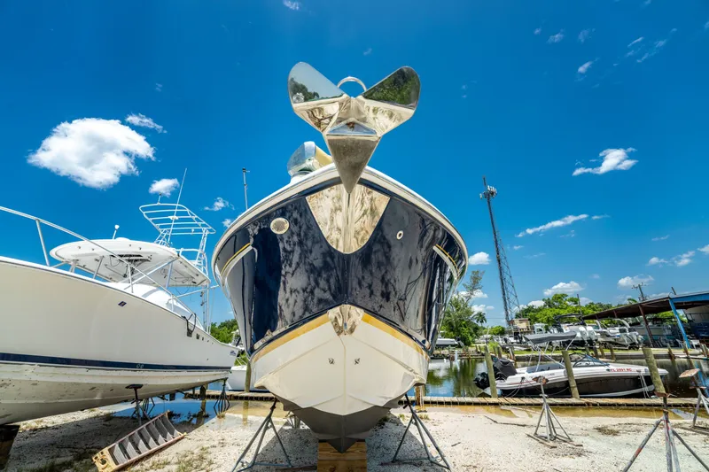 Slide: The Image of 2013 Chaparral 327 SSX boat on dry dock under clear blue sky. - 82