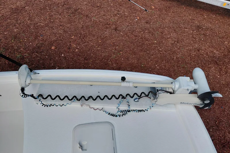 Slide: The Image of 2015 Mako Pro Skiff 17 CC with MotorGuide trolling motor on deck. - 17