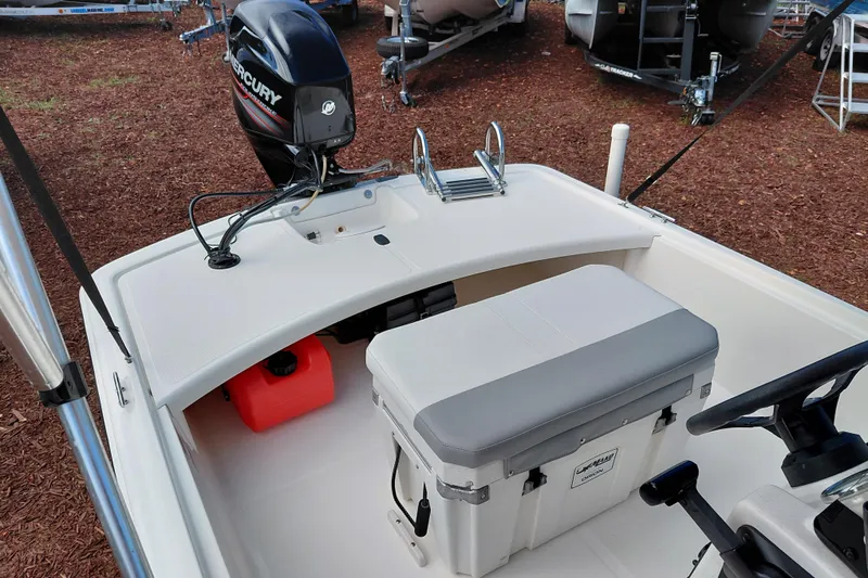 Slide: The Image of 2015 Mako Pro Skiff 17 CC boat interior with Mercury outboard motor. - 25
