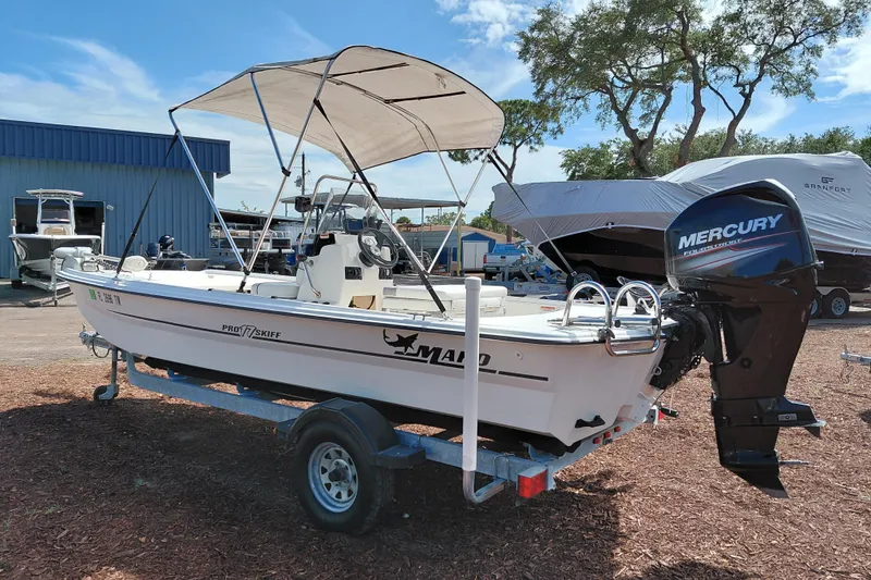 Slide: The Image of 2015 Mako Pro Skiff 17 CC boat with Mercury outboard motor on trailer. - 5