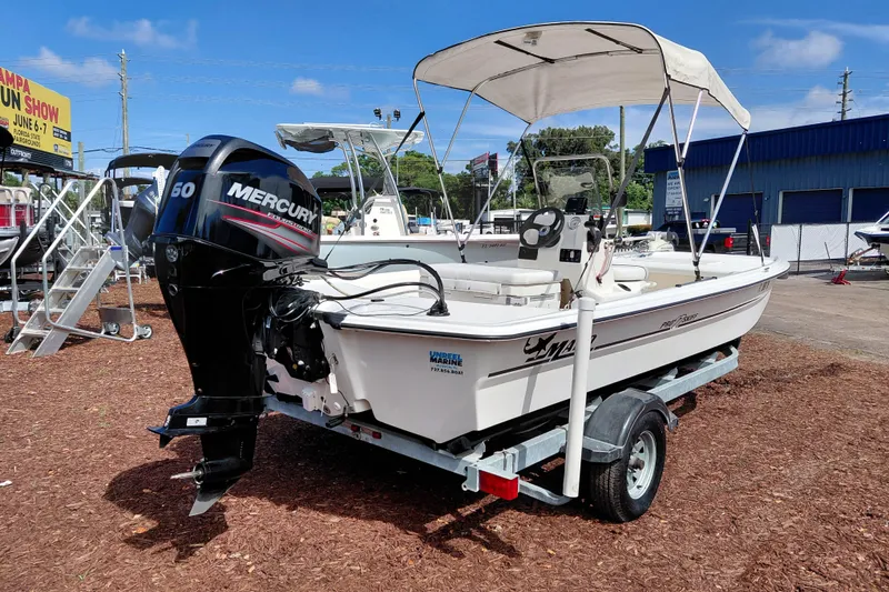 Slide: The Image of 2015 Mako Pro Skiff 17 CC boat with Mercury engine on trailer. - 7