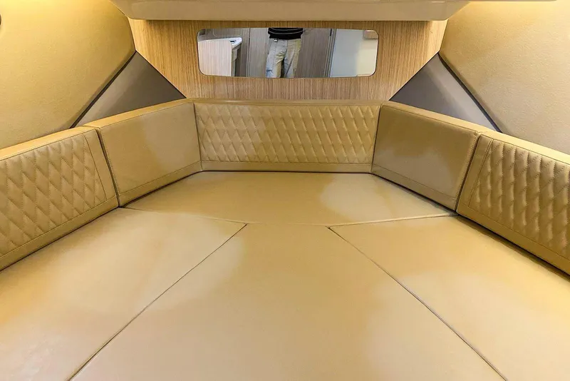Slide: The Image of Luxurious interior of 2027 Hanover 387 boat with beige leather seating and wood accents. - 4