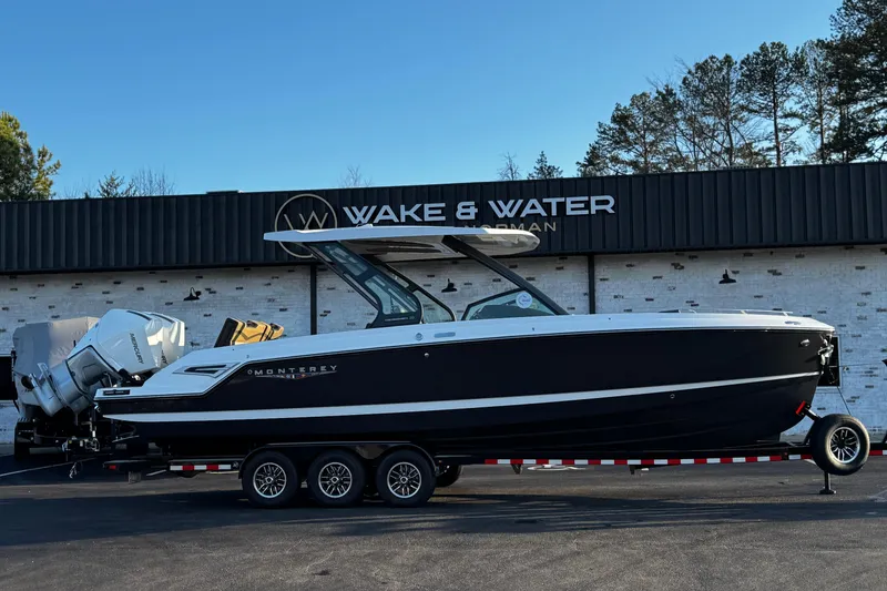 The Image of 2026 Monterey Elite 30 OB boat on trailer at Wake & Water dealership. - 0