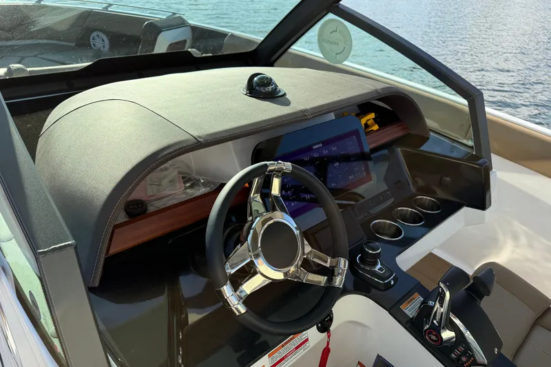 Slide: The Image of Cockpit of 2026 Monterey Elite 30 OB boat with modern steering and controls. - 21