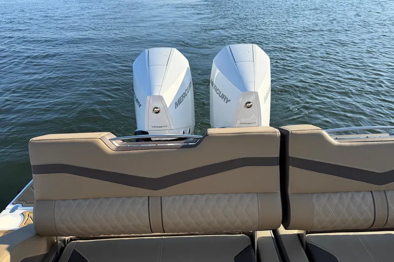 Slide: The Image of 2026 Monterey Elite 30 OB boat with dual Mercury Verado engines on water. - 22