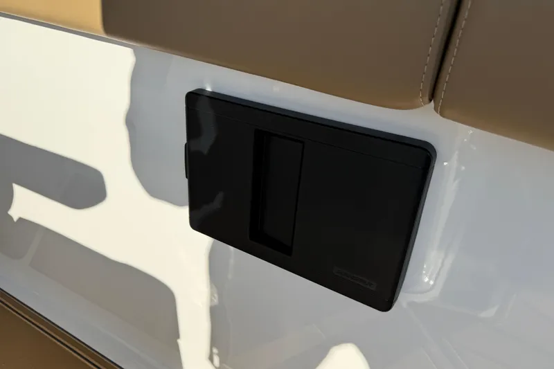 Slide: The Image of 2026 Monterey Elite 30 OB boat detail with black panel and beige upholstery. - 26