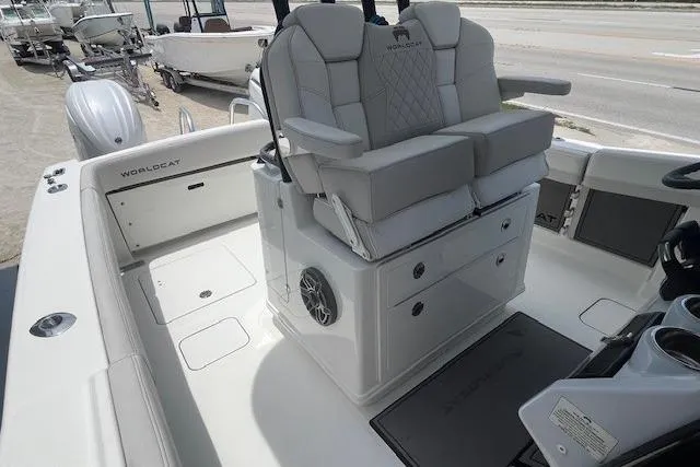 Slide: The Image of 2025 World Cat 280 CC-X boat interior with dual seating and storage compartments. - 5