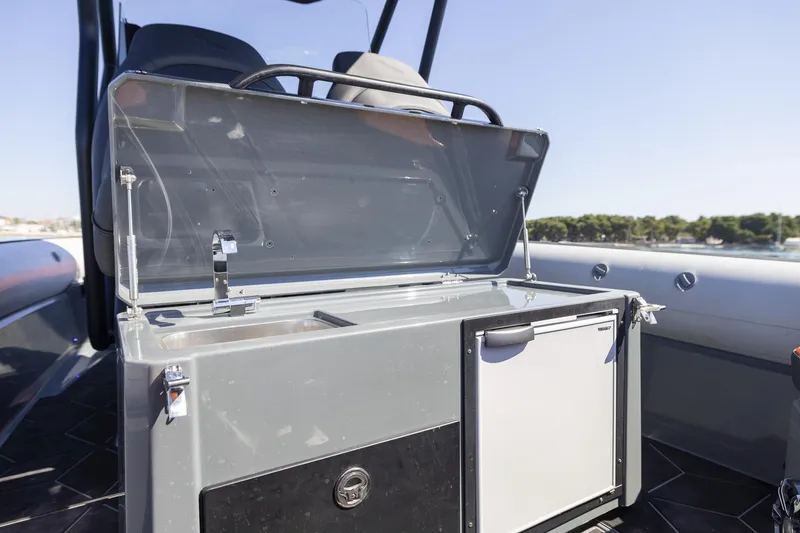 Slide: The Image of 2026 Highfield ADV7 boat interior with open kitchenette and sink. - 10