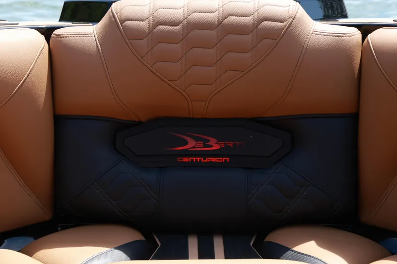 Slide: The Image of 2024 Centurion Ri265 boat interior with tan and black leather seating. - 16