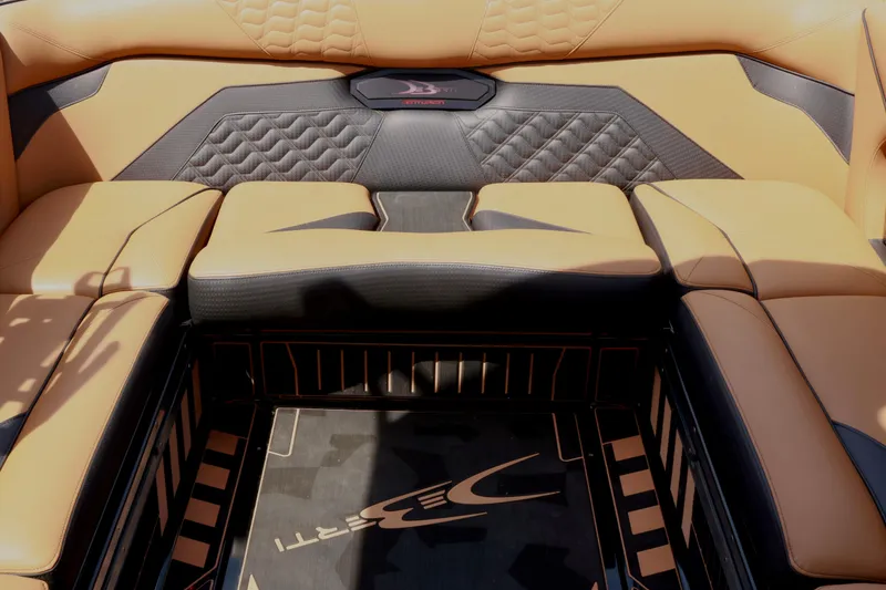 Slide: The Image of Luxurious interior seating of 2024 Centurion Ri265 boat with tan and black upholstery. - 19