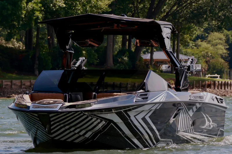 Slide: The Image of 2024 Centurion Ri265 boat on water, featuring sleek design and modern graphics. - 5