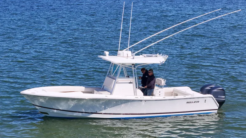 Slide: The Image of 2006 Regulator 29 Forward Seating boat on the water. - 31