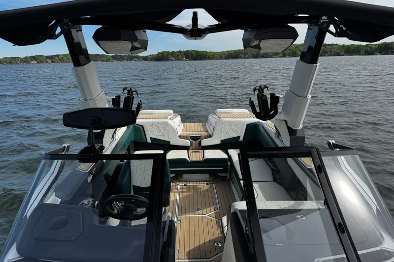 Slide: The Image of 2020 Nautique Super Air Nautique G23 Paragon interior on a serene lake. - 13