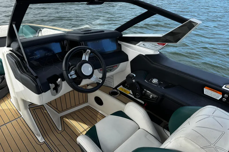 Slide: The Image of 2020 Nautique Super Air Nautique G23 Paragon boat interior with modern dashboard and steering. - 17