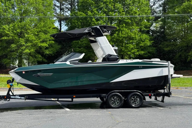 Slide: The Image of 2020 Nautique Super Air Nautique G23 Paragon boat on trailer, parked outdoors. - 8
