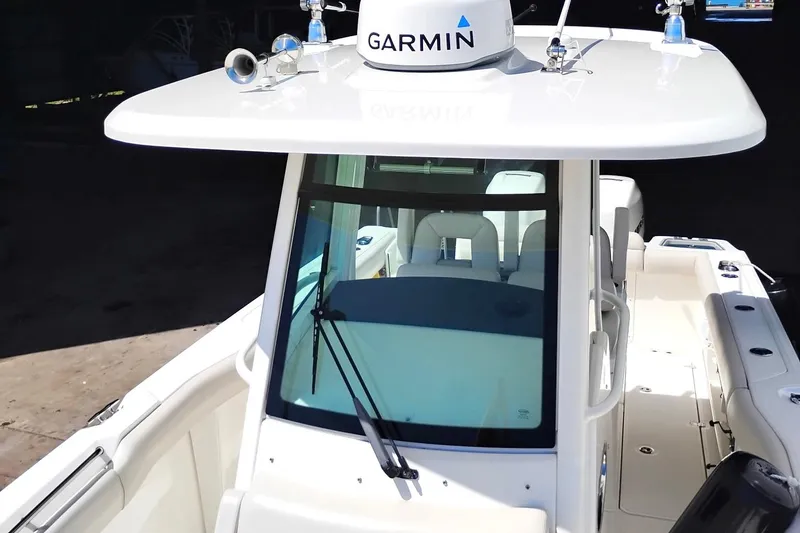 Slide: The Image of 2018 Boston Whaler 280 Outrage boat with Garmin equipment, viewed from the front. - 14
