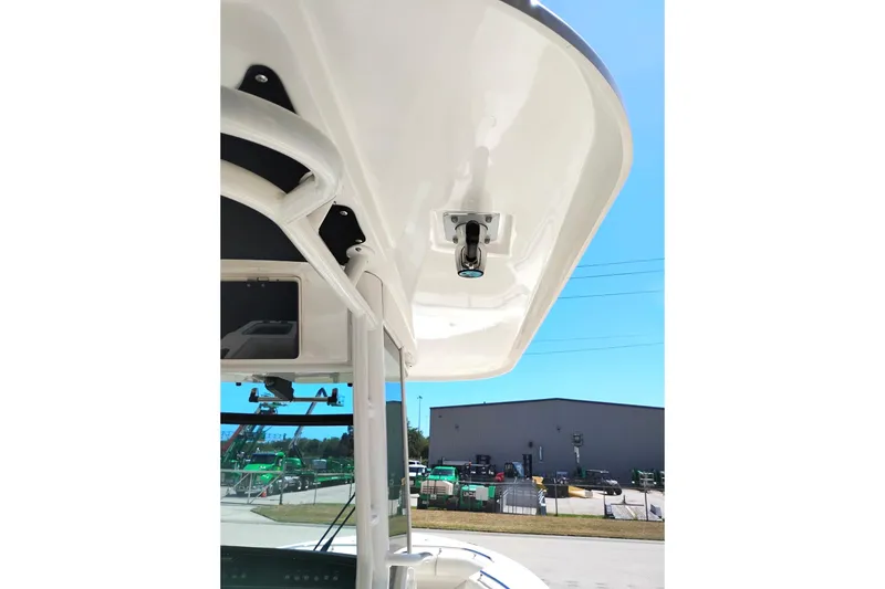 Slide: The Image of 2018 Boston Whaler 280 Outrage boat canopy detail under clear blue sky. - 15
