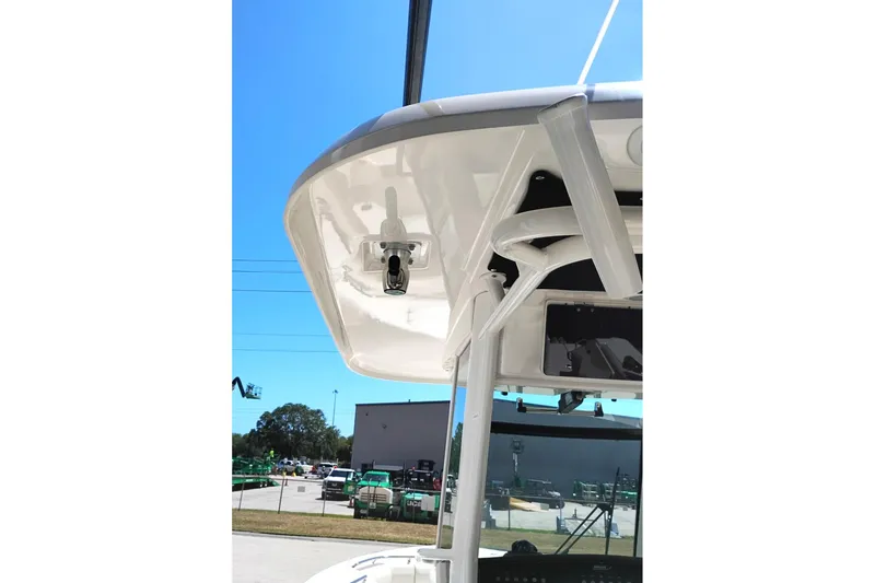 Slide: The Image of 2018 Boston Whaler 280 Outrage boat's helm station with rod holders and electronics. - 16