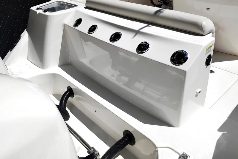 Slide: The Image of 2018 Boston Whaler 280 Outrage interior with seating and control panel details. - 18