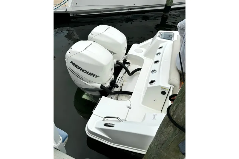Slide: The Image of 2018 Boston Whaler 280 Outrage with twin Mercury outboard engines docked at marina. - 19