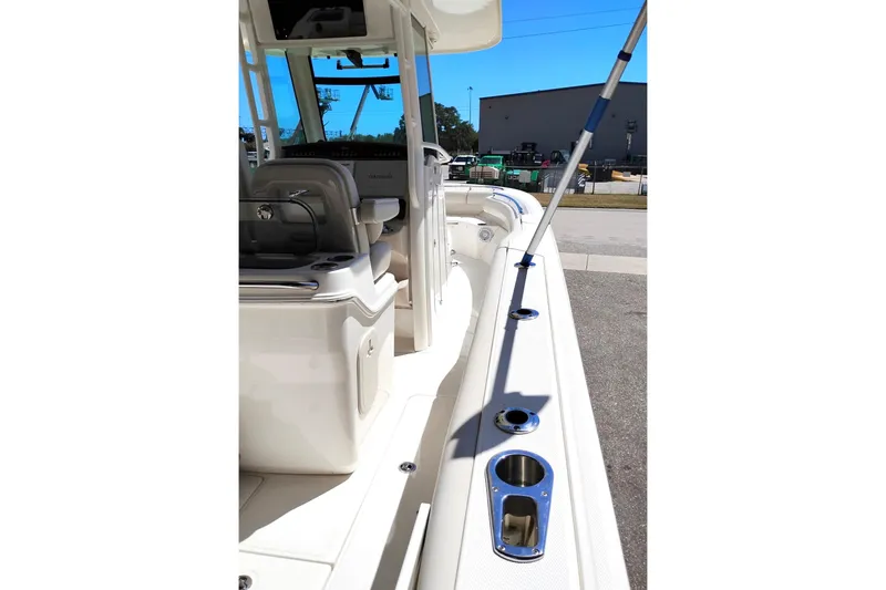 Slide: The Image of 2018 Boston Whaler 280 Outrage boat interior with seating and rod holders. - 22