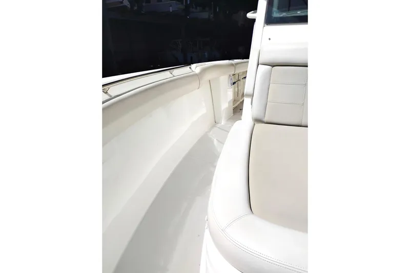 Slide: The Image of 2018 Boston Whaler 280 Outrage boat interior with white seating and sleek design. - 25