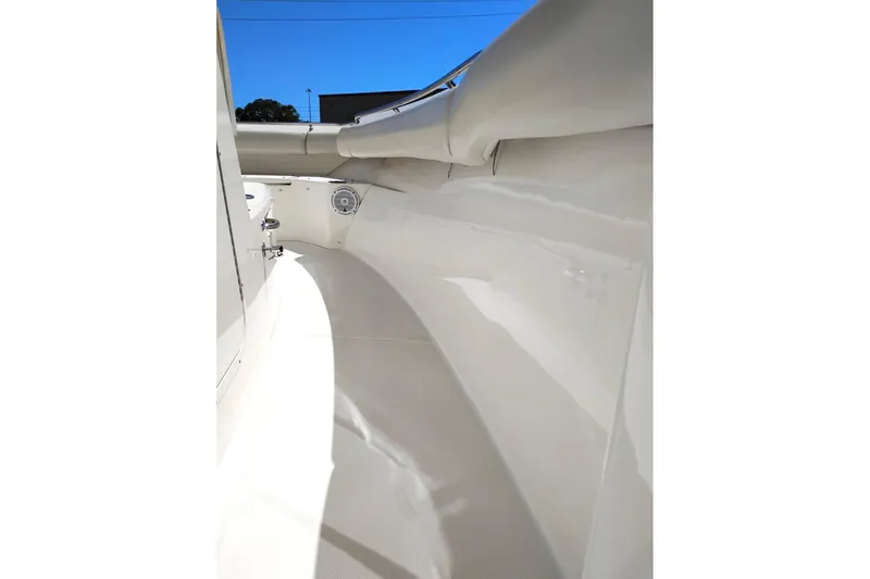 Slide: The Image of Interior view of 2018 Boston Whaler 280 Outrage boat, showcasing sleek white design. - 26