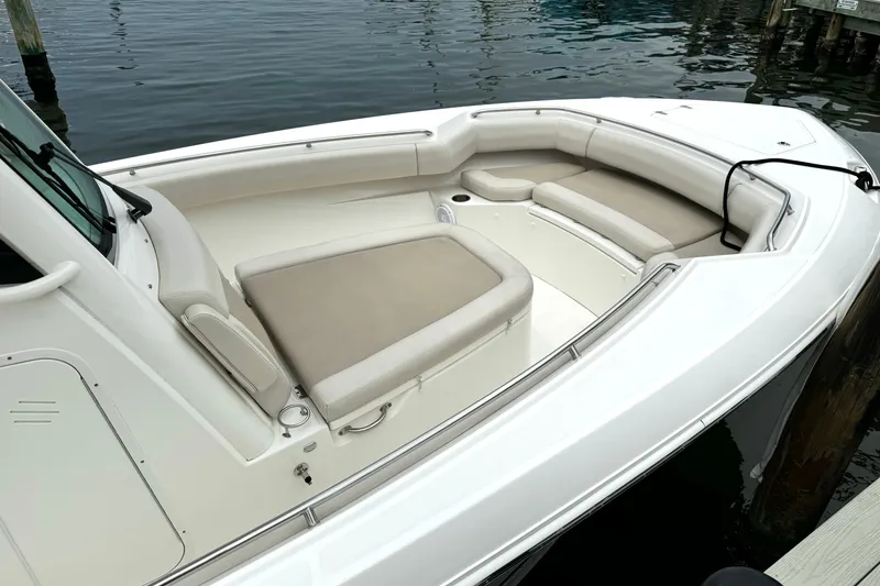 Slide: The Image of 2018 Boston Whaler 280 Outrage boat with spacious seating at the dock. - 27