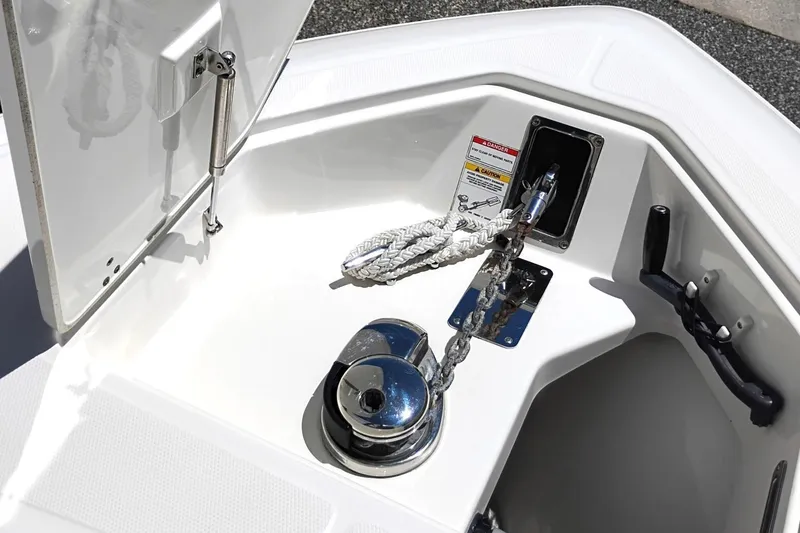 Slide: The Image of Anchor system of a 2018 Boston Whaler 280 Outrage boat, featuring a secure rope and chain. - 28
