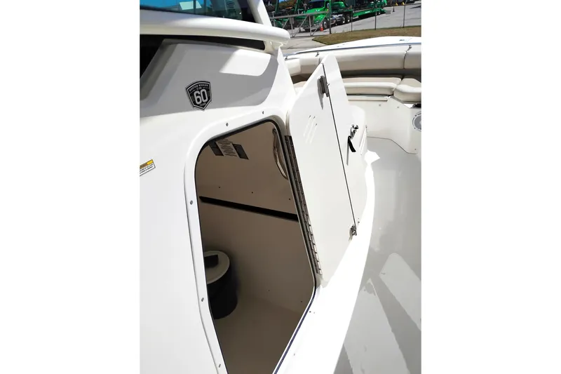 Slide: The Image of 2018 Boston Whaler 280 Outrage boat interior storage compartment open. - 29