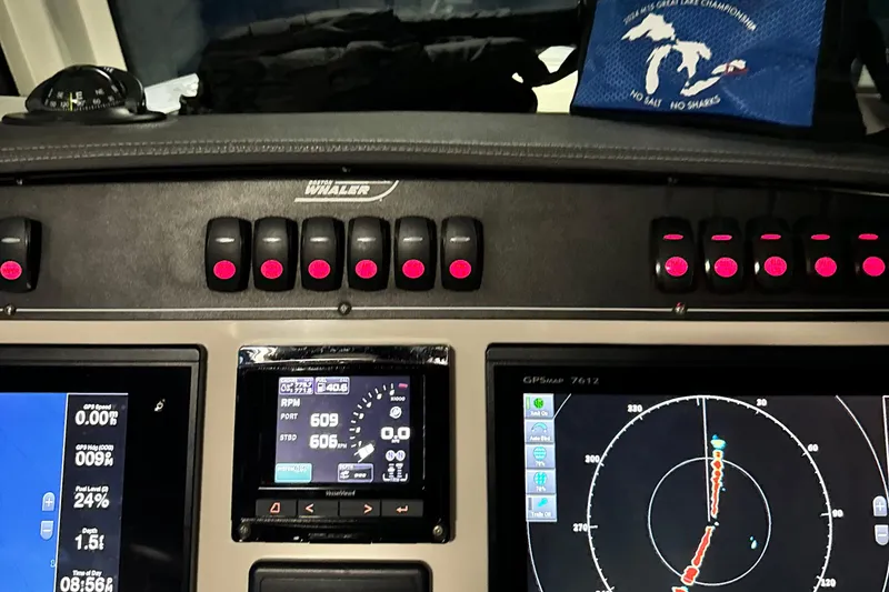 Slide: The Image of Dashboard of a 2018 Boston Whaler 280 Outrage with navigation and control systems. - 31