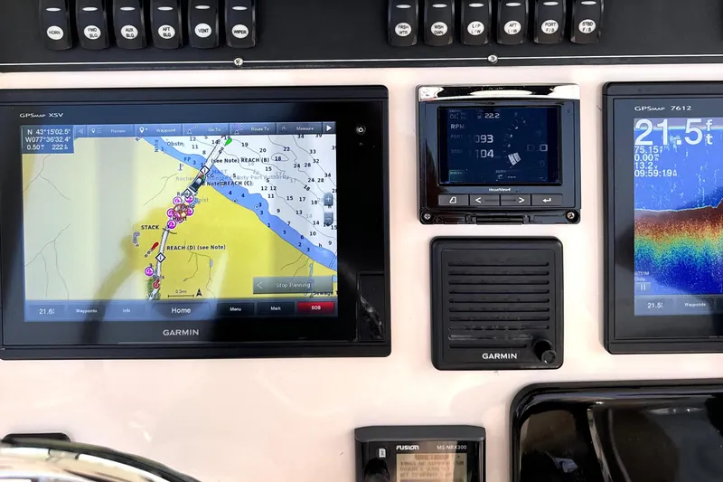 Slide: The Image of Dashboard of a 2018 Boston Whaler 280 Outrage with Garmin navigation displays. - 32