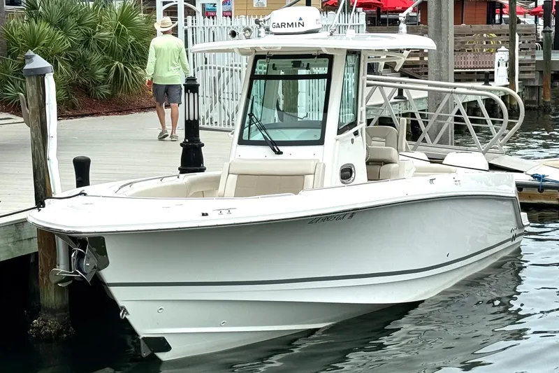 Slide: The Image of 2018 Boston Whaler 280 Outrage docked, featuring sleek design and modern equipment. - 5