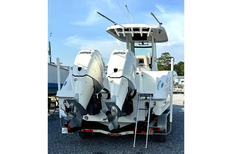 Slide: The Image of 2018 Boston Whaler 280 Outrage with dual outboard engines, rear view. - 7