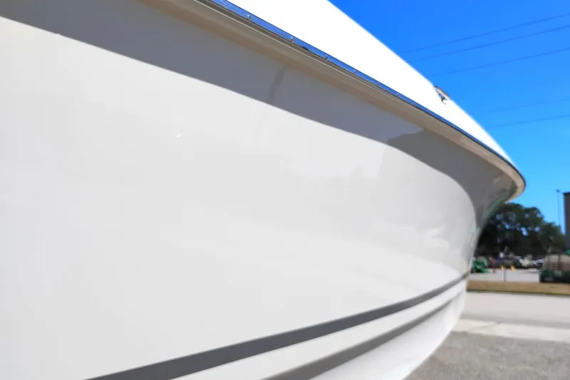 Slide: The Image of Close-up of a 2018 Boston Whaler 280 Outrage boat hull under clear blue sky. - 9