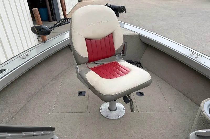 Slide: The Image of 2004 Bass Tracker Tournament V-18 boat seat with red and beige upholstery. - 14