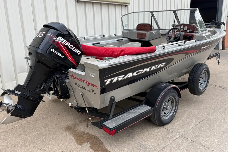 Slide: The Image of 2004 Bass Tracker Tournament V-18 boat with Mercury OptiMax engine on trailer. - 2