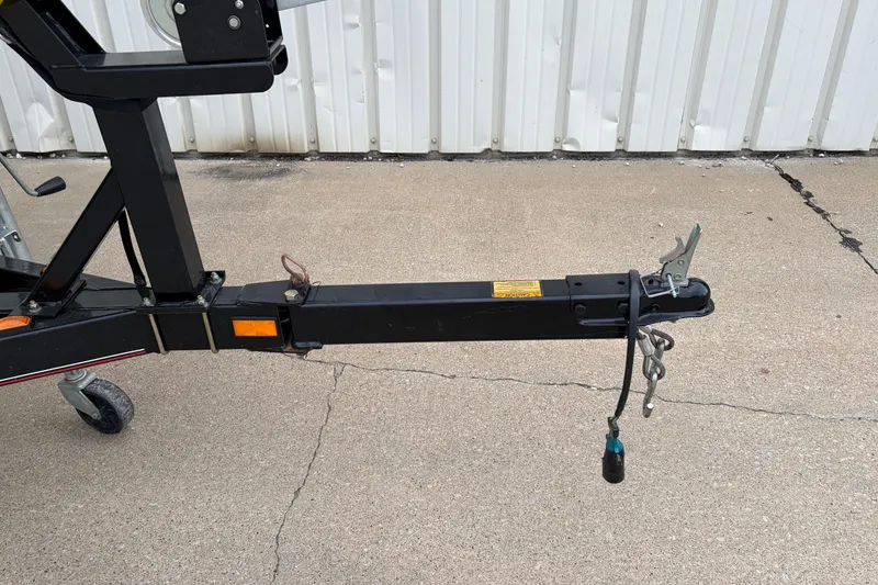 Slide: The Image of Trailer hitch of a 2004 Bass Tracker Tournament V-18 on concrete surface. - 21