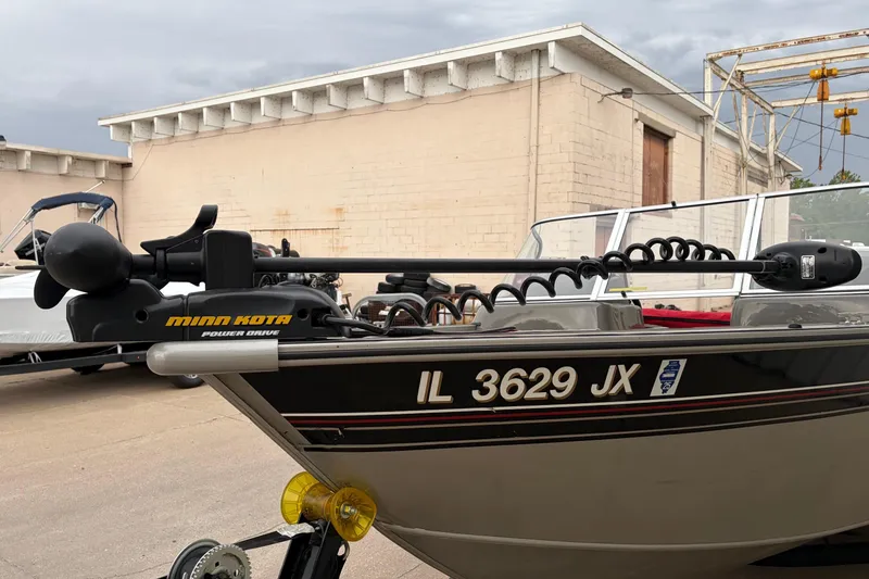 Slide: The Image of 2004 Bass Tracker Tournament V-18 boat with Minn Kota Power Drive motor. - 22