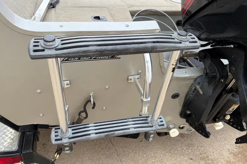 Slide: The Image of 2004 Bass Tracker Tournament V-18 boat ladder and motor detail. - 24