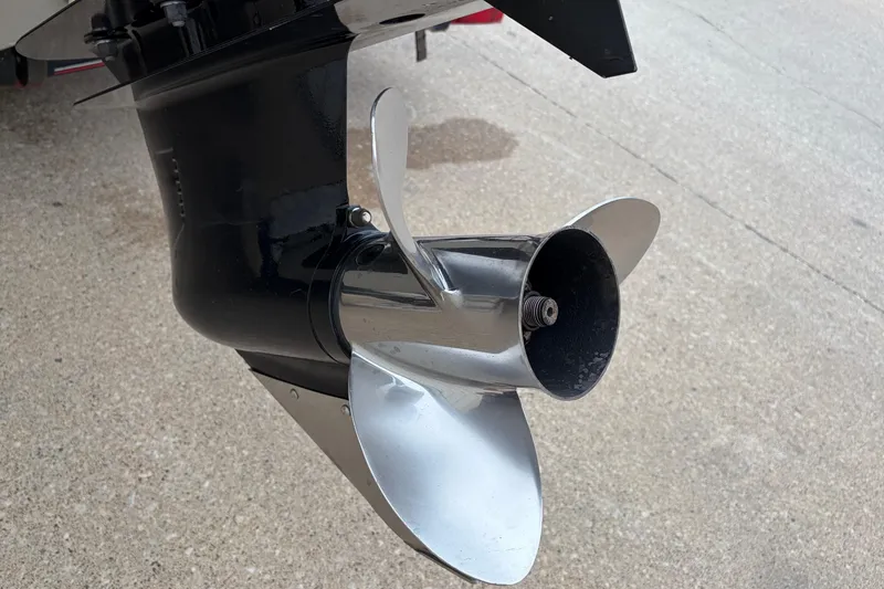 Slide: The Image of Propeller of a 2004 Bass Tracker Tournament V-18 boat on concrete surface. - 25
