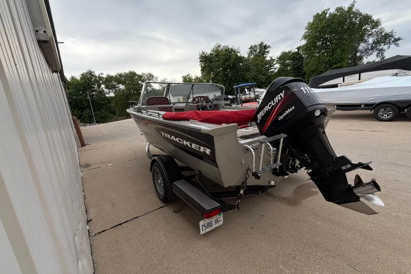 Slide: The Image of 2004 Bass Tracker Tournament V-18 boat with Mercury OptiMax engine on trailer. - 6