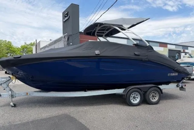 Slide: The Image of 2022 Yamaha Boats 252SD on trailer, covered, parked outdoors. - 3