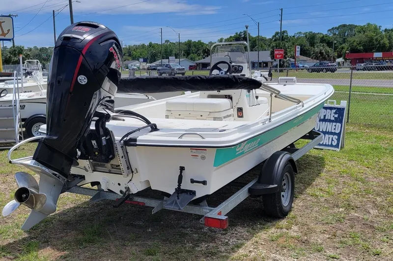 Slide: The Image of 2020 Mako Pro Skiff 19 CC boat on trailer, displayed outdoors at a dealership. - 3