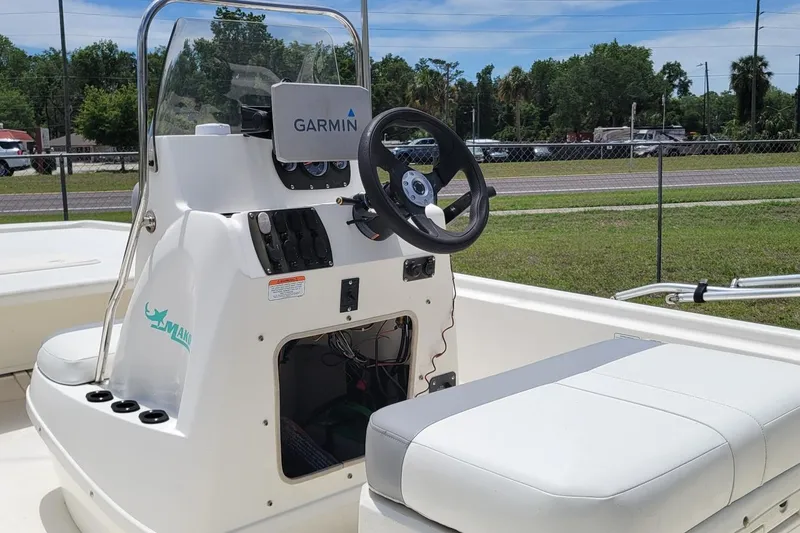 Slide: The Image of 2020 Mako Pro Skiff 19 CC boat console with Garmin navigation system. - 7